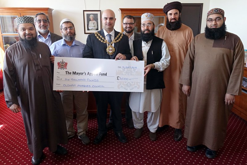 memners of Oldham Mosques' Coucil present a cheque to the Mayor - Councillor Shadab Qumer