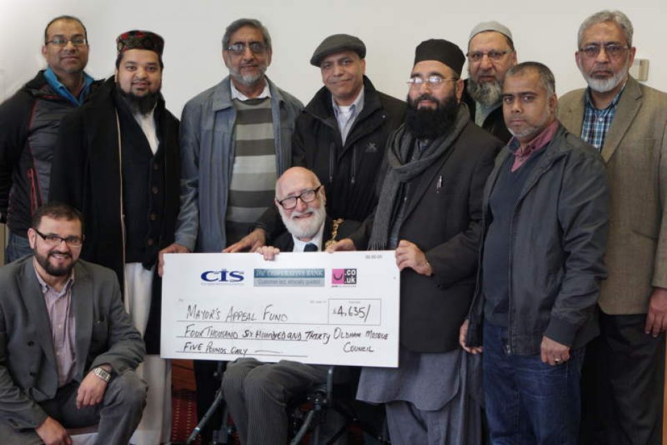Group of representatives of Oldham Mosques Council presenting Cheque for the Mayor's Charities to Mayor Derek Heffernan