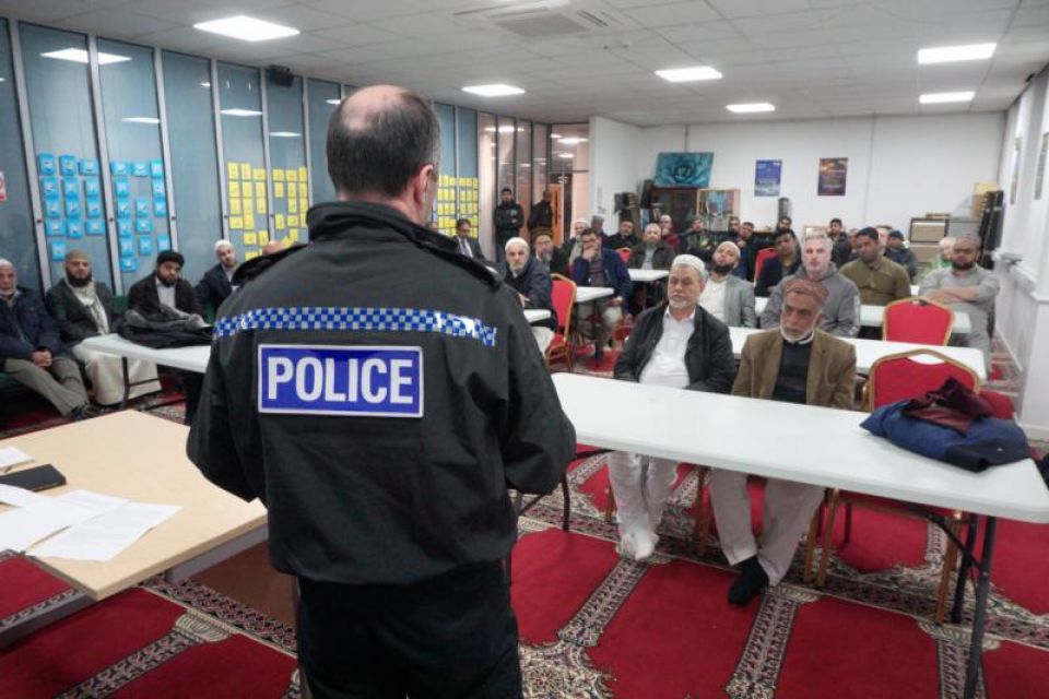 Representative from Greater Manchester Police at Oldham Mosque Coincil's meeting to show solidarity with London